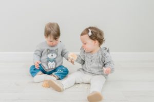 kids play with cupcakes during milestone photos