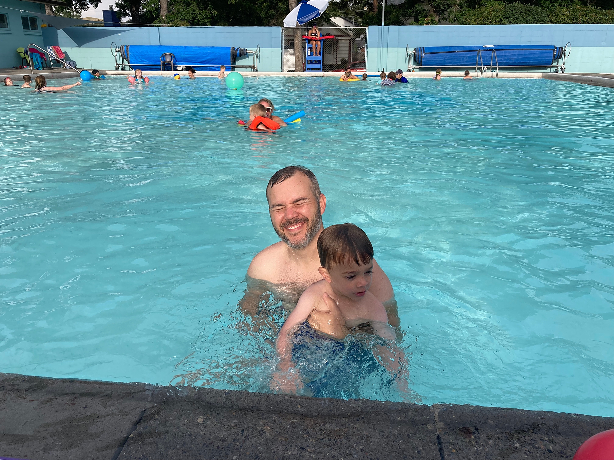 bogert_pool_bozeman_montana_father_and_son_swimming