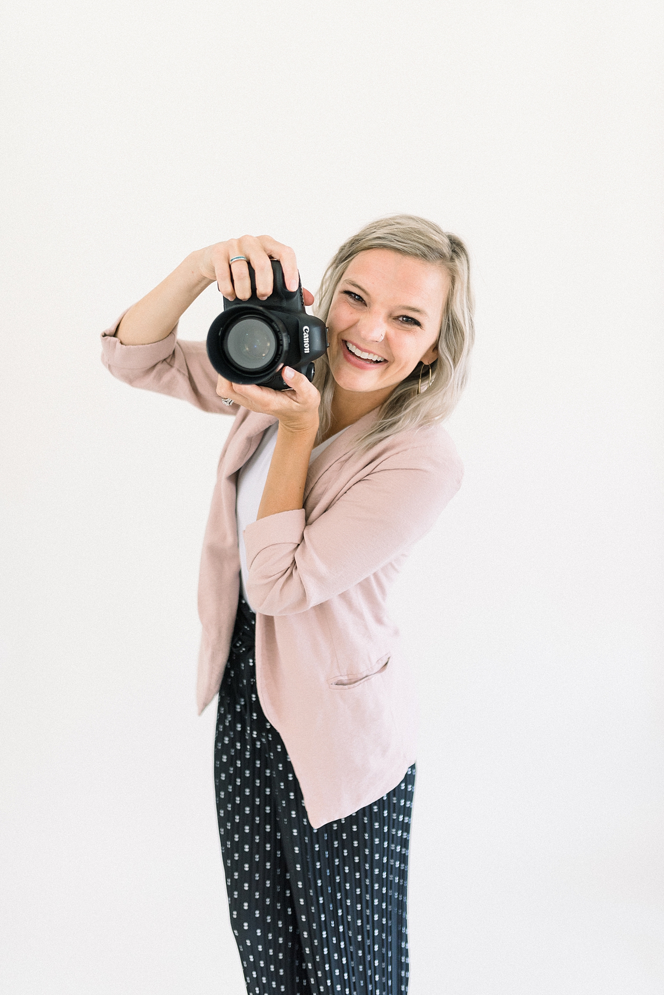 a_wedding_photographer_is_smiling_at_the_camera_for_her_branding_photos_with_Dolly_DeLong_Photography_in_Bozeman_Montana