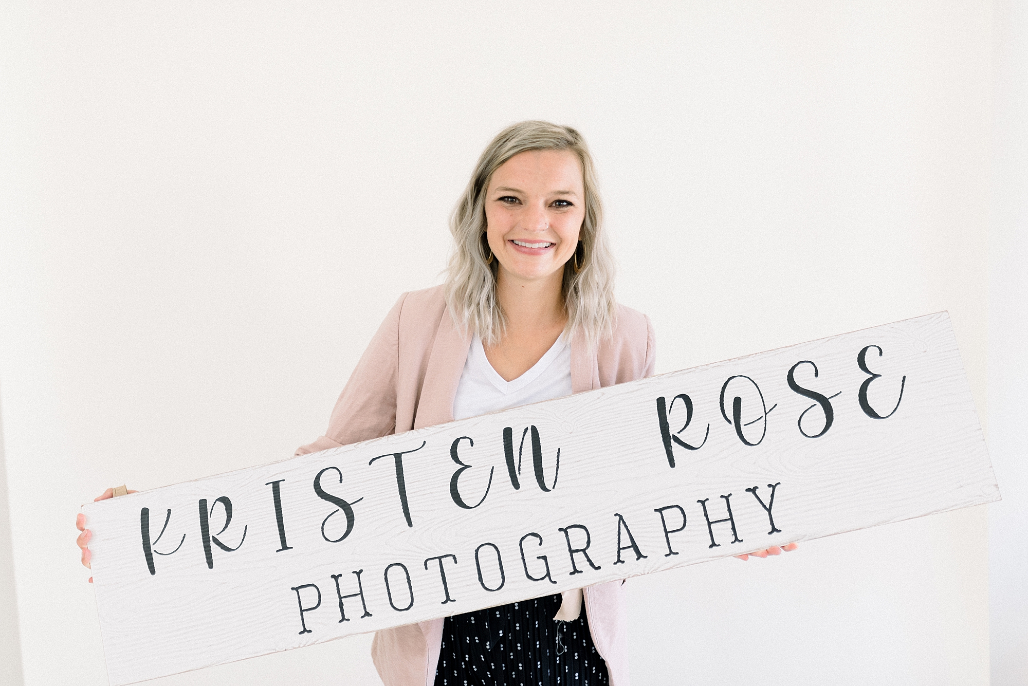 a_wedding_photographer_is_smiling_at_the_camera_for_her_branding_photos_with_Dolly_DeLong_Photography_in_Bozeman_Montana
