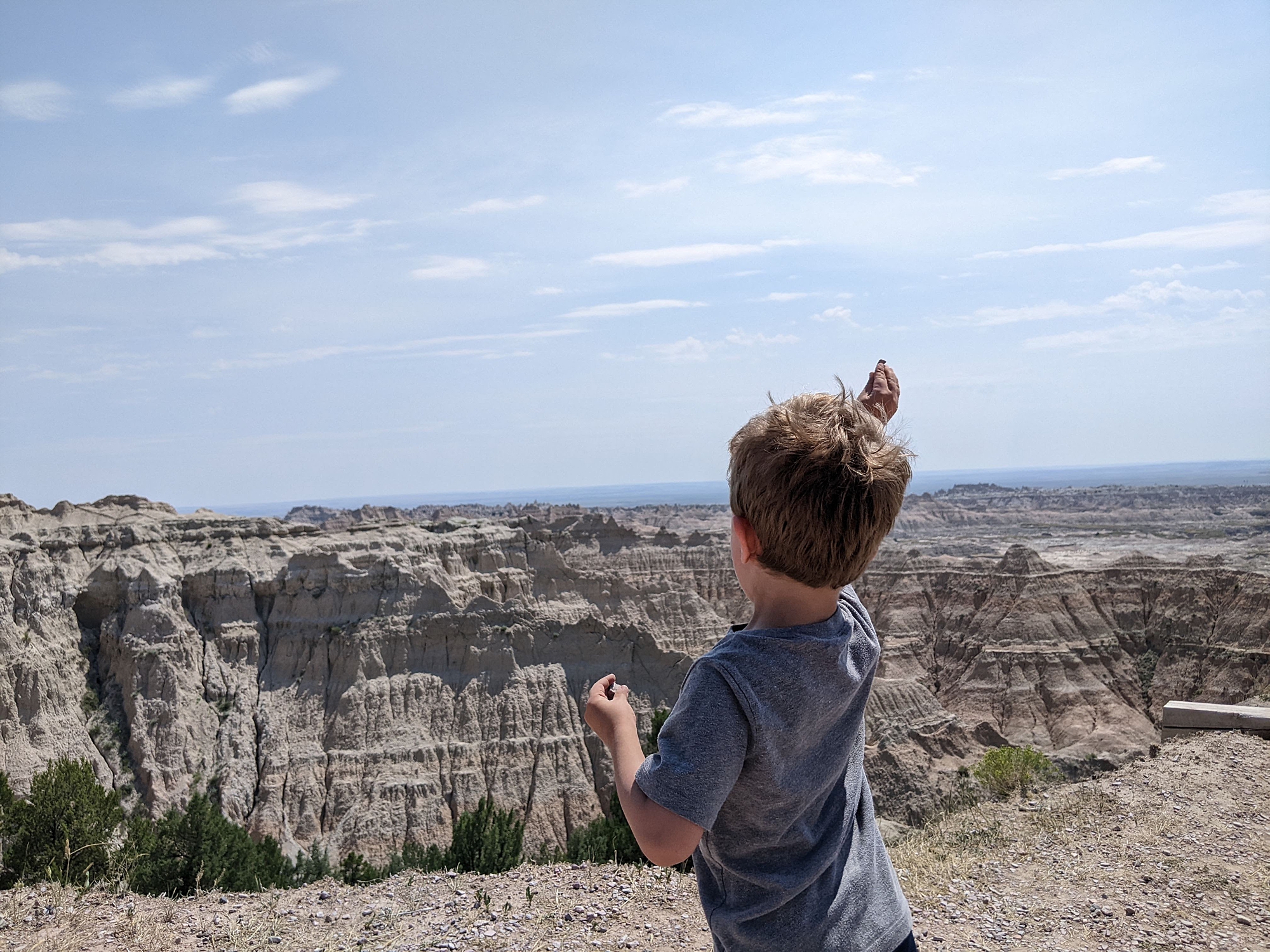 toddler_boy_throwing_rocks_at_Badlands_national_parks