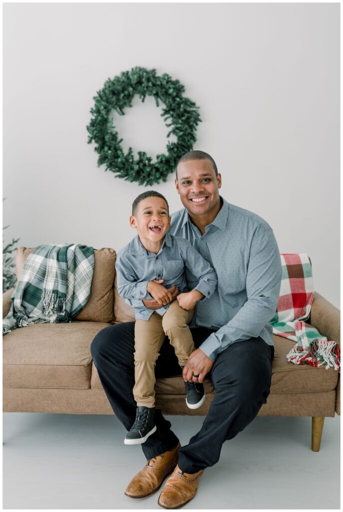 Dad_and_Son_Smiling_For_Holiday_Photos_with_Nashville_Family_Photographer_Dolly_DeLong_Photography