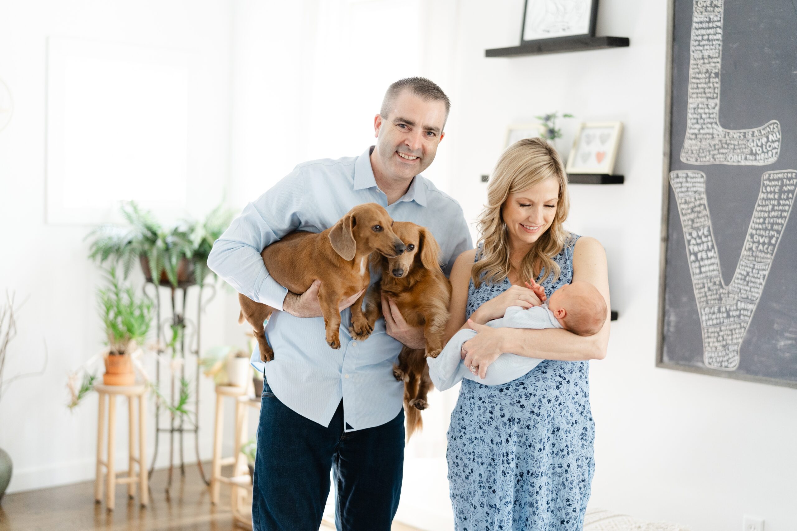 a-mom-and-dad-are-holding-their-newborn-son-for-photos-with-nashville-newborn-photographer-dolly-delong