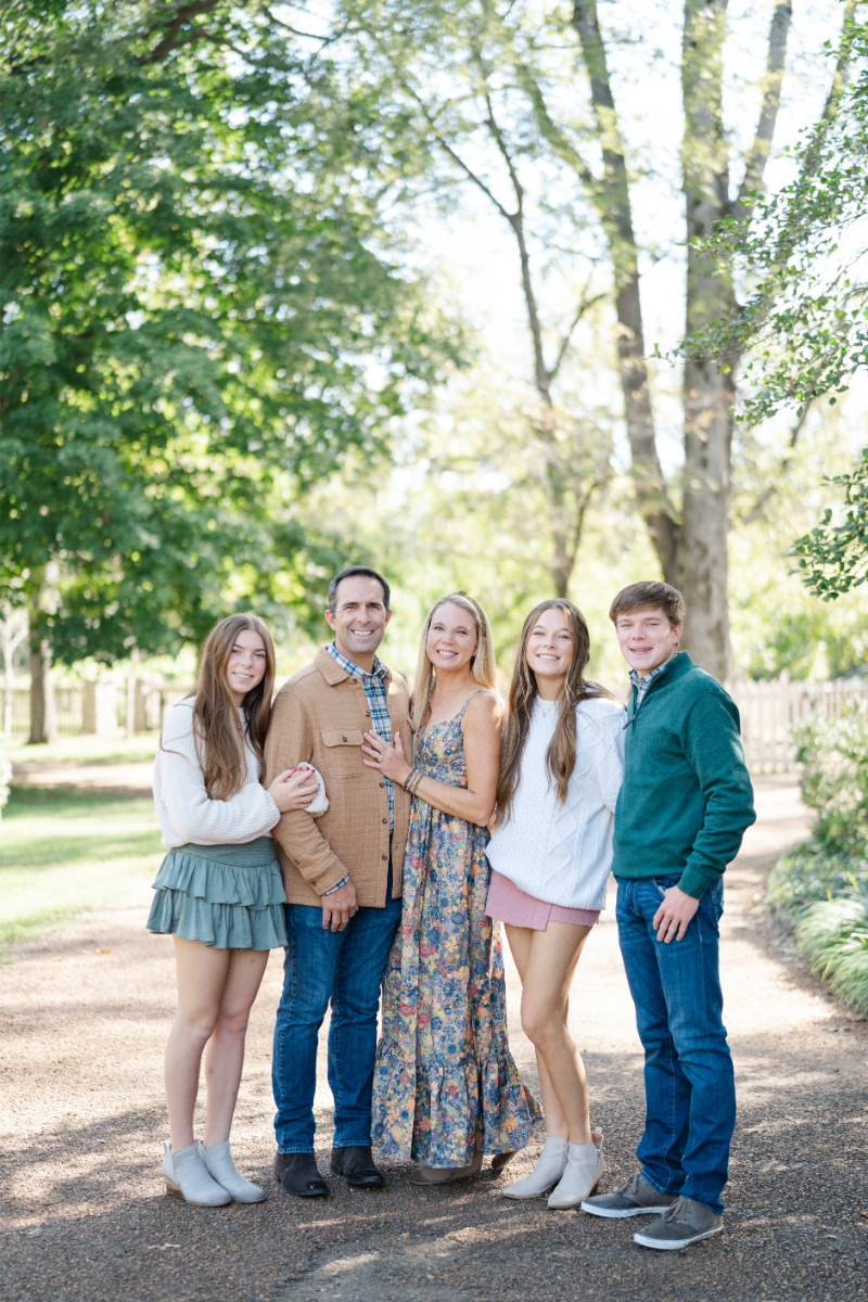 A joyful family capturing memories together at the scenic Belle Meade Plantation