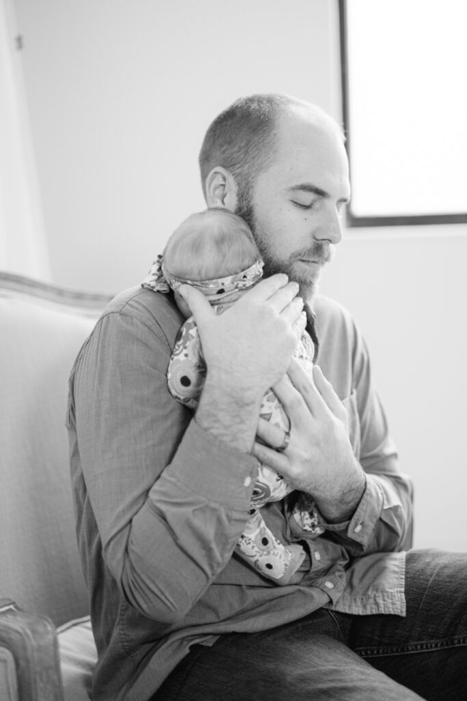 Dad hugging baby
