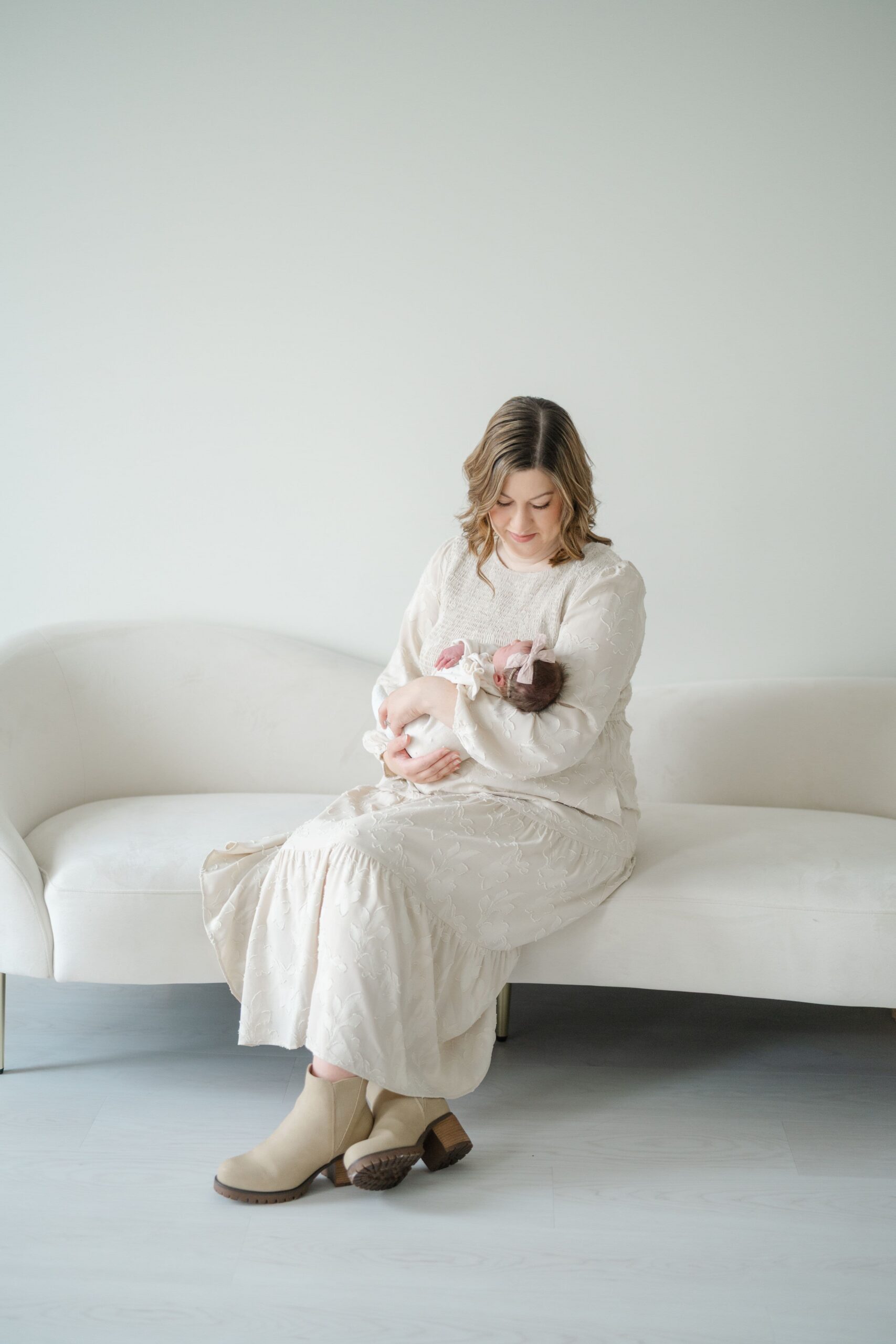 New mom holding her newborn baby during a Mother’s Day portrait session in Franklin TN.
