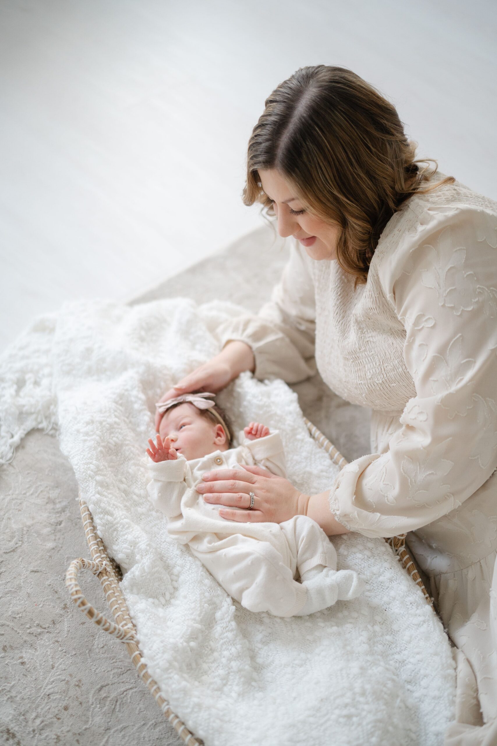 Mother with newborn baby during a motherhood portrait mini session in Franklin TN.