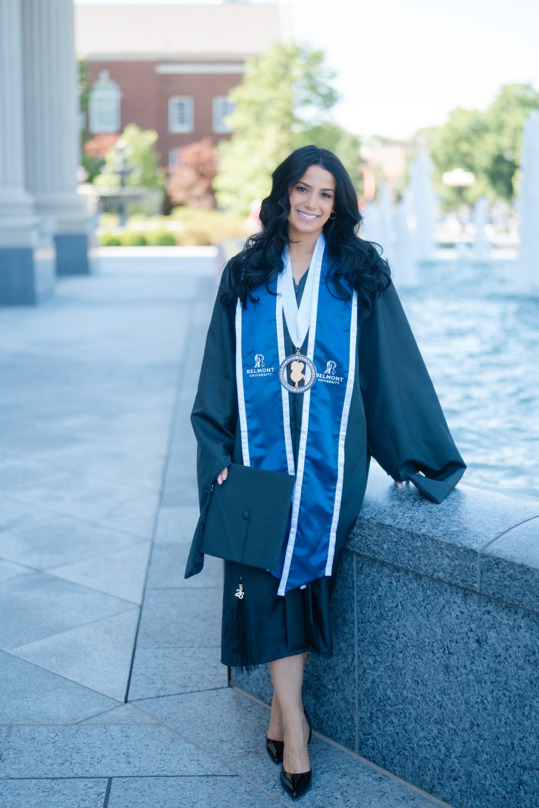 Belmont University graduation portrait near the fountain in front of the fisher center of performing arts