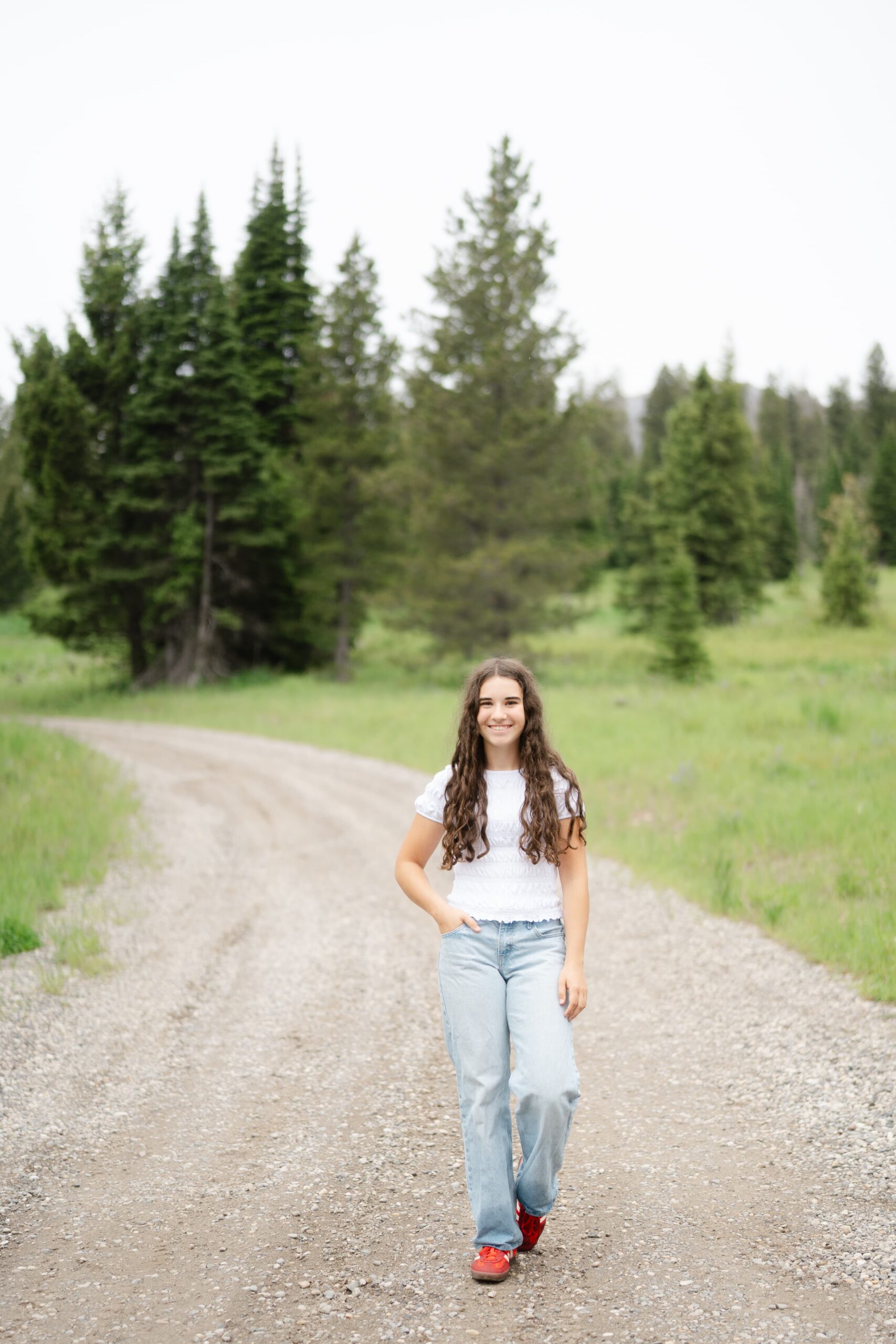 A senior portrait session on a gravel trail at a favorite Montana hiking spot near Bozeman.