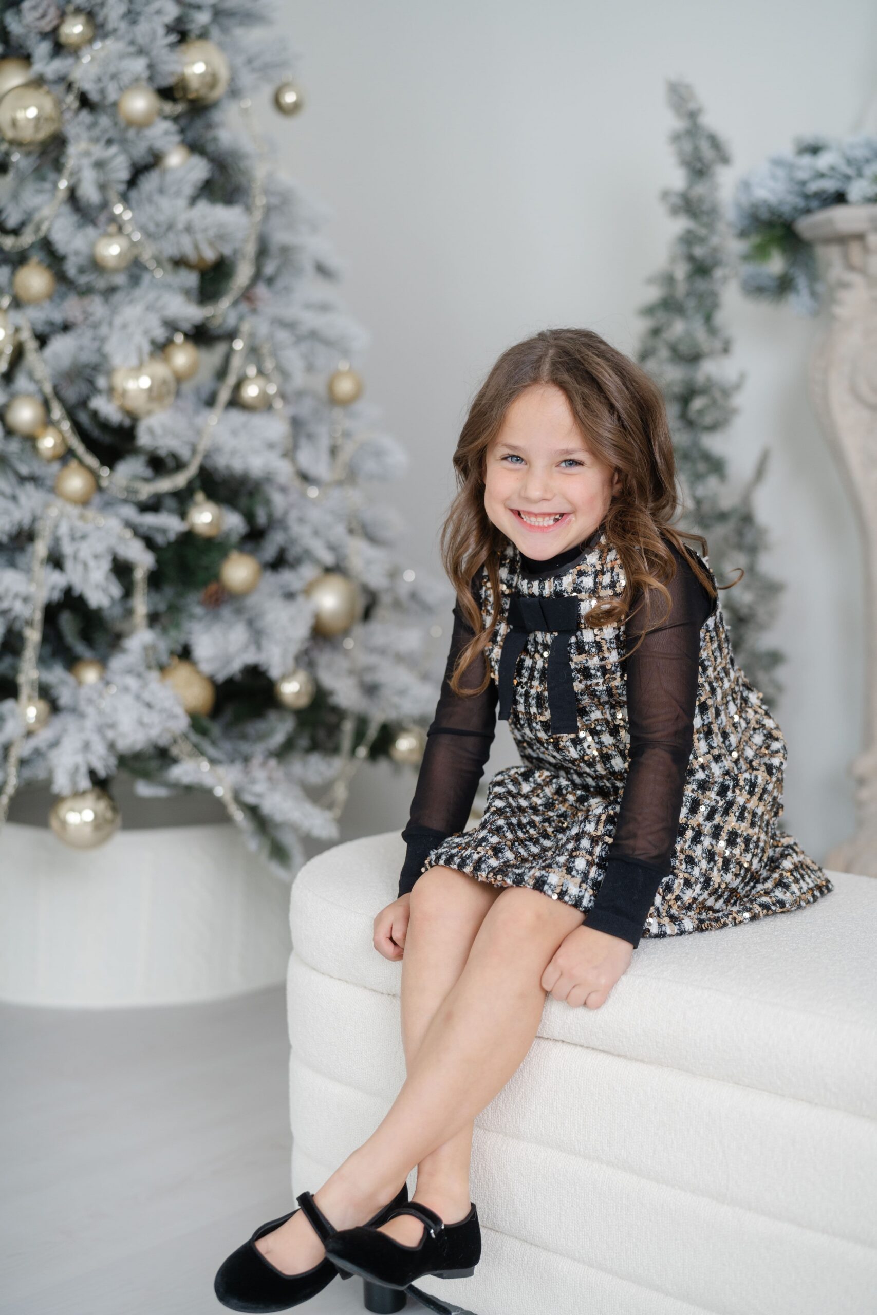 Texture over pattern, a black and gold dress at a holiday mini session near Nashville