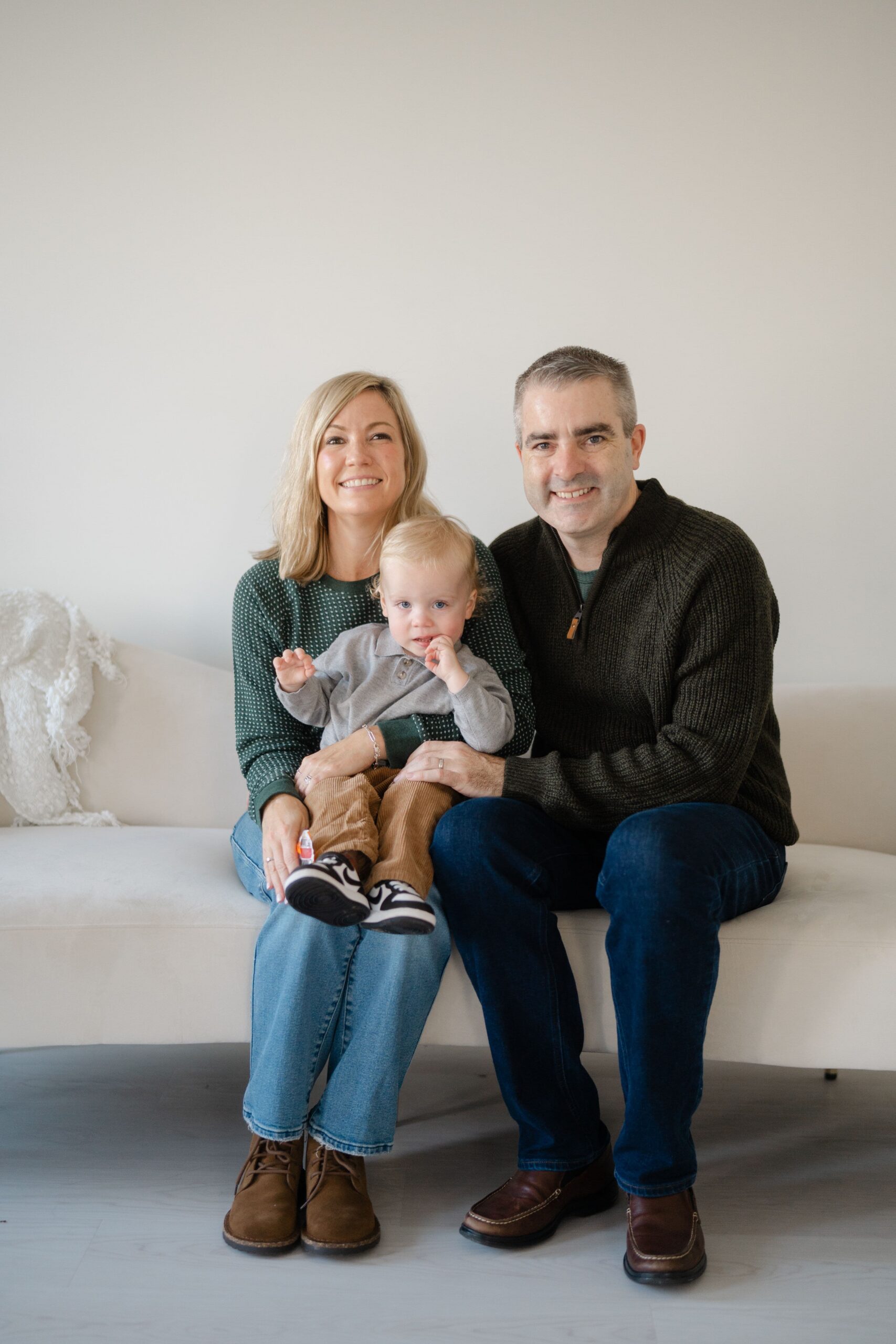 Green sweaters and jeans, an easy outfit approach for Santa photos in Franklin, Tennessee